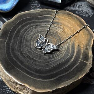Bloodmilk Petite Datura Moth necklace on 16” chain